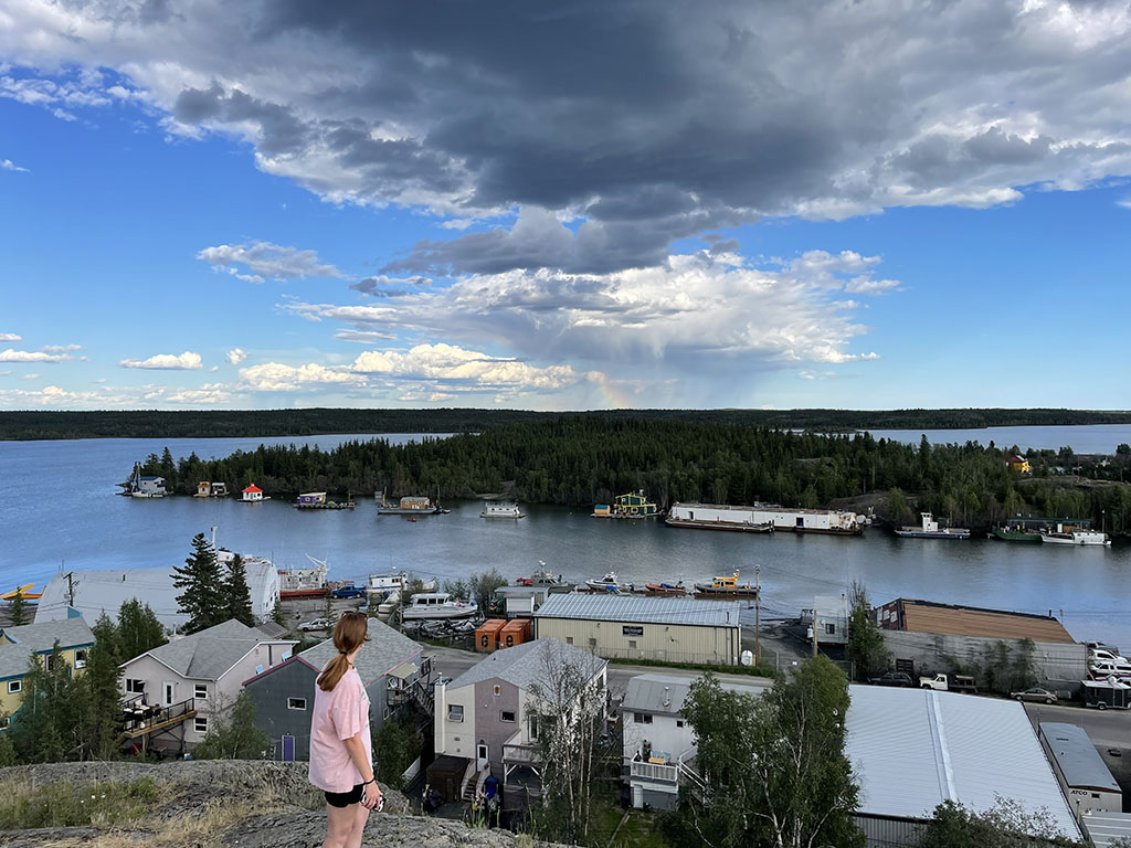 Catriona Koenig looking out at Yellowknife Bay. Photographed by Mckenna Hadley-Burke. 